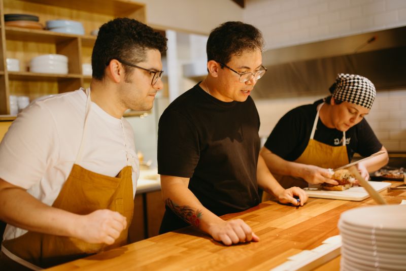 Costa Vida kitchen crew preparing fresh food together